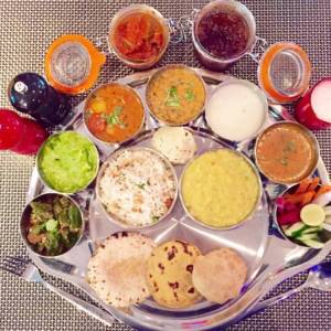 Image Of Colorful and Tempting Indian Thalis Which placed around the Main Dish
